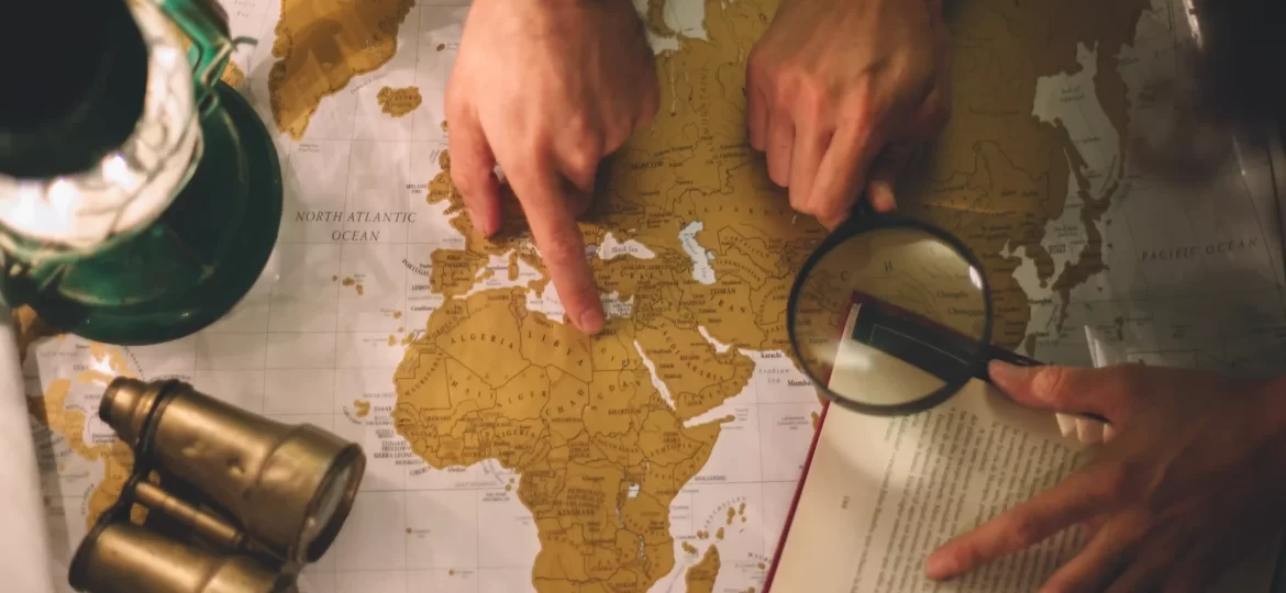 crop-hands-with-magnifying-glass-map